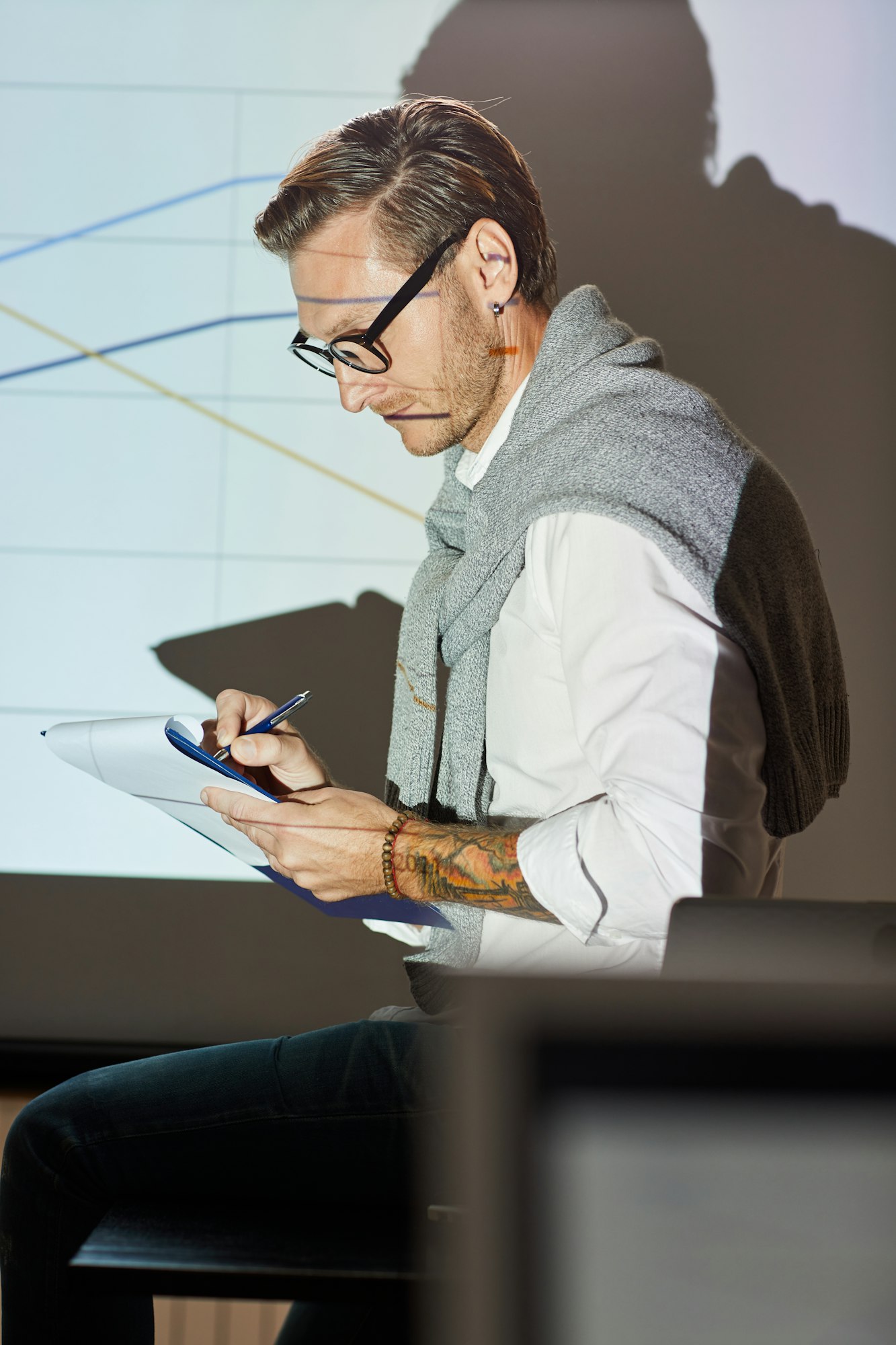 Financial coach making notes in paper